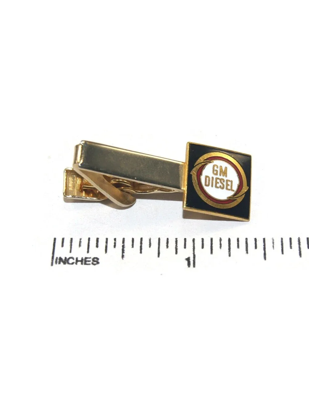 Vintage Gold Tone, Black and White Enamel GM Diesel Logo Tie Clip.